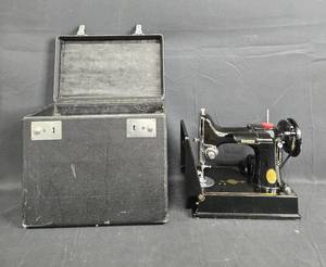 lot 36 image: Singer Portable Electric Sewing Machine No. 221K1 with Case