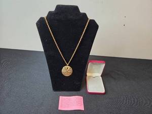 lot 63 image: Gold Tone Sand Dollar Pendant Necklace