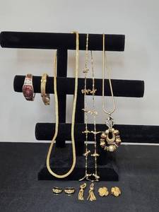 lot 96 image: Collection of Gold-Tone Costume Jewelry Including Earrings, Bracelets, and Necklaces