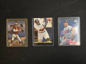 lot 133 image: Collection of 3 Sports Trading Cards featuring Steve Young, Greg Maddux, and Frank Thomas