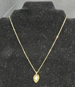 lot 247 image: Gold Tone Necklace with Genuine Ruby, Sapphire, and Opal Pendant