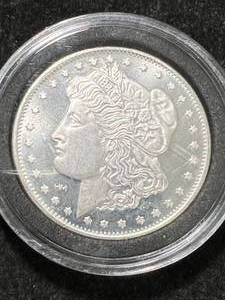 lot 27 image: 1 TROY OZ .999 FINE SILVER MORGAN DOLLAR ROUND IN AIRTITE