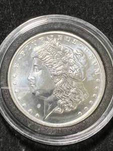 lot 47 image: 1 TROY OZ .999 FINE SILVER MORGAN DOLLAR ROUND IN AIRTITE