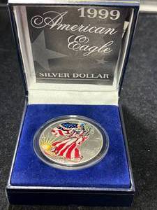 lot 86 image: 1999 AMERICAN SILVER EAGLE IN COLOR 1 TROY OZ .999 FINE SILVER