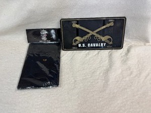 lot 137 image: US Calvary License Plate Tag and Stand for the Flag Kneel for the Cross 3 x5 Flag (Both appear unused)