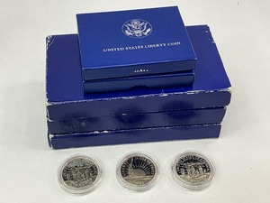 lot 9 image: 11pc Liberty Commemorative Collection wSilver Dollars