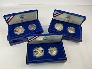 lot 12 image: 3x 1986 2pc Silver Commemorative Dollar and Clad Half Dollar