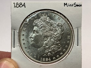 lot 52 image: 1884 Morgan Silver Dollar (MS)
