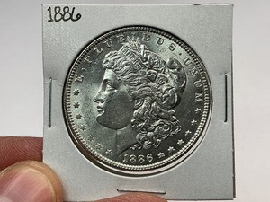 lot 55 image: 1886 Morgan Silver Dollar
