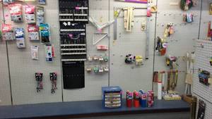 lot 39 image: Lighted Peg Board, hooks and Shelving.