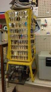lot 134 image: Key Cutting Machine and dozens of blank keys.