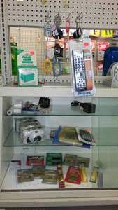 lot 139 image: Assortment Keychains, camera, calculators and more.