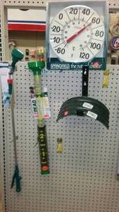 lot 258 image: Outdoor Garden Hose hanger, spray wand, rain gauge.