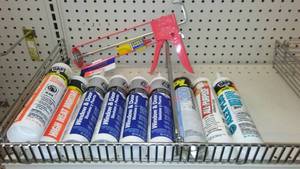 lot 365 image: Caulking Assortment (9) and Gun. Dap, GE.