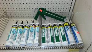 lot 366 image: Caulking Assortment (11) and Gun. Dap, PL.