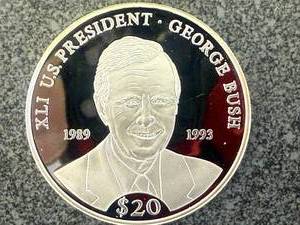 lot 49 image: 2000 Republic of Liberia $20 George Bush Coin 20 grams .999 Silver