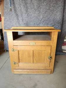 lot 60 image: White Clad Cabinet with rotating Tabletop  NOTICE Buyer is responsible for Loading and Removal 