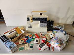 lot 66 image: Model 6267 Singer Sewing machine, Works, and a lot of misc. sewing Accessories Needles, Snaps, Hooks and so much more