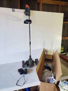lot 86 image: Hand Held Brush Hog with Charger