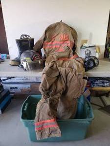 lot 128 image: WOW St Paul Firefighters uniform and Helmet  This is a super Cool Lot