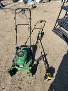 lot 183 image: John Deere Push Lawnmower and Weed eater   Mower Works Weed Eater Needs work NOTICE Buyer is responsible for Loading and Removal 