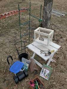 lot 195 image: Small Garden Table with Garden Items, Awesome Rolling Garden Chair Birdhouse Garden Tools and more