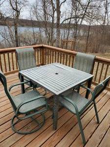 lot 217 image: PatioDeck Table with 4 Chairs and Umbrella Stand Umbrella not included NOTICE Buyer is responsible for Loading and Removal 