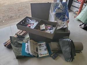 lot 233 image: LARGE Military Lot, Military 2-tiered Wooden Box, Folding Cot with foam pad, Large Ammo Shell, Patches, And SO Much More