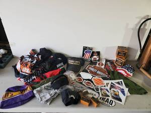 lot 237 image: Harley Davidson Lot of Emblems,Large Sturgis Flag,  DoRags, Hankys, Stickers Sunglasses and So Much More
