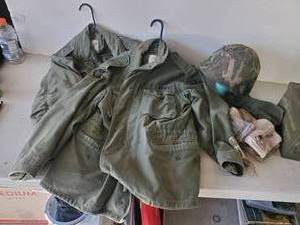 lot 296 image: Military Jackets Cartridge Case, Helmet and more