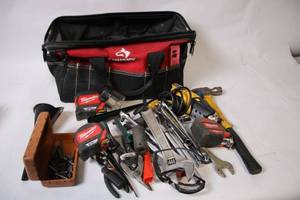 lot 23 image: Comprehensive Tool Set with Bag Including Wrenches, Tape Measures, and More
