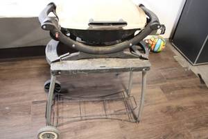 lot 25 image: Used Weber Q Gas Grill with Cart