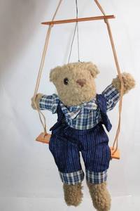 lot 460 image: Plush Teddy Bear on Wooden Swing in Checked Outfit