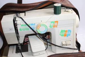 lot 495 image: Elnita 200 Sewing Machine Bundle with Books and Accessories