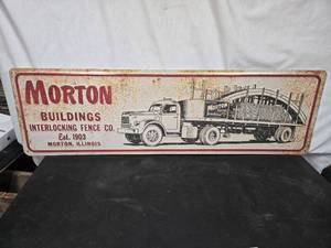 lot 5 image: Vintage Morton Buildings Metal Sign with Truck Graphic - approximately 37 inches in width and 11 inches in height