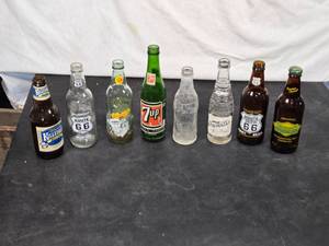 lot 41 image: Vintage Soda Bottles Assortment including brands like Killebrew, Route 66, Kentucky Nip, 7UP, and Nesbitts