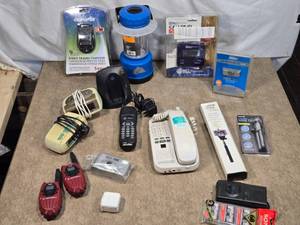 lot 107 image: Lot of Mixed Electronics and Accessories including cordless phones with answering systems, a pair of walkie-talkies, a mini tripod, a selfie stick, a caller ID unit, and a microcassette recorder with tapes
