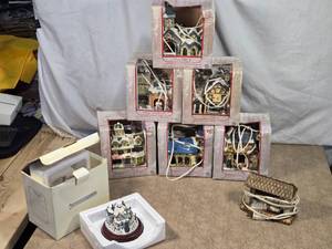 lot 124 image: Porcelain Christmas Village Buildings with Lights set includes a Town Church, Oxford School, Toy Shop, Country Church, Village House, and Village Fire Station
