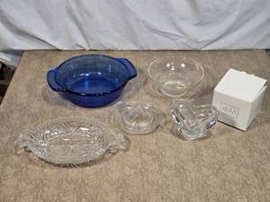 lot 54 image: Lot of Glassware Items such as a large blue dish, a clear bowl, and a heart-shaped Mikasa piece.