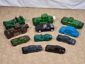lot 84 image: Vintage Avon Glass Car Shaped Bottles