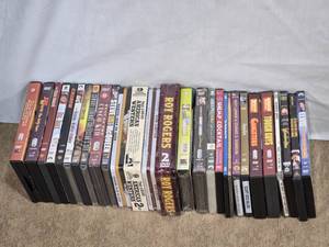 lot 144 image: Lot of Classic Western and Vintage DVDs starring John Wayne, Steve McQueen, and Roy Rogers, along with other vintage films and TV shows
