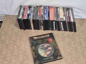 lot 145 image: Lot of DVDs and Movie Memorabilia - Spider-Man, The Dark Knight, Gladiator, and Casino Royale. Pirates of the Caribbean