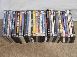 lot 146 image: Large Assortment of DVDs like Full Metal Jacket, Saving Private Ryan, G.I. Jane, and Documentaries like The Civil War A Nation Divided and Through the Wormhole with Morgan Freeman.