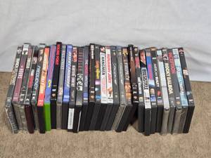 lot 148 image: DVDs Featuring Various Movies such as Inception, American Beauty, Rocky Balboa, The Bourne Ultimatum, and Casino Royale.