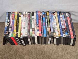 lot 149 image: Mixed DVDs Including Comedies and Dramas like Knocked Up, Chicago, 13 Going on 30, and West Side Story.