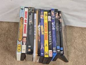 lot 153 image: DVDs and TV Series Box Sets including The Golden Compass, Twilight, and Drumline, along with TV series like Person of Interest and Best of Monk.