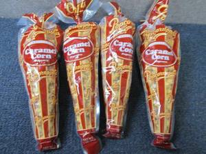 lot 344 image: 4- 7oz Popcornopolis Caramel Corn...