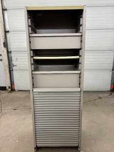 lot 25 image: Herman Miller Milcare Multi-Drawer Storage Cabinet  Features Smooth Roll-Up Accordion Door  Durable, Clean Design Ideal for Medical, Lab, or Office Use  Trusted Quality & Functionality- Good Condition