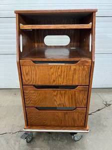 lot 42 image: Mobile Standing Podium Desk with 3 Drawers  Includes lockable wheels for easy mobility  Perfect for home offices, clinics, or labs  Great Condition