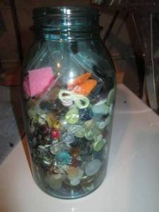 lot 207 image: Blue Glass canning jar containing a...